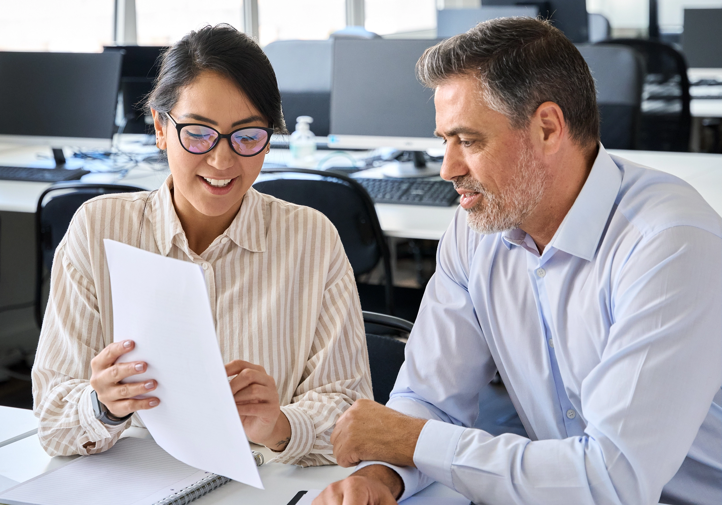 nimbus workforce management solution. man and woman in office in a meeting