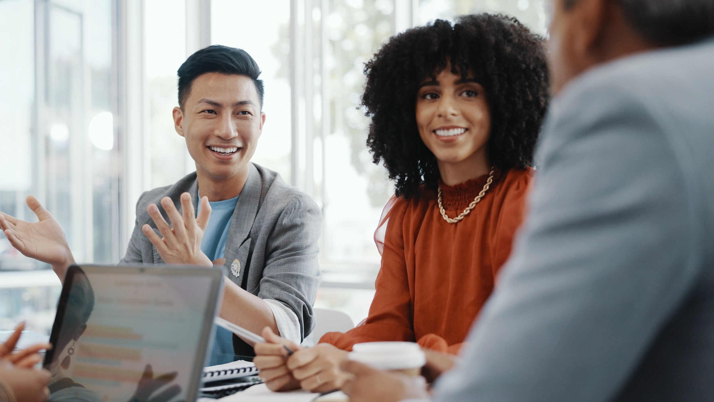 nimbus employee scheduling software - colleagues in meeting room